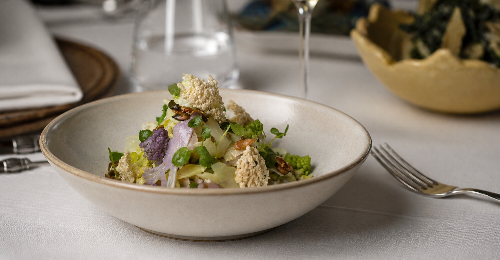 THE EMBER · Romanesco and cauliflower bowl with seeds and herbs